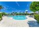 Relaxing pool area with lounge chairs, umbrellas, and lush landscaping offering a resort-style experience at 315 Sapphire Lake Dr # 101, Bradenton, FL 34209