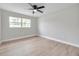 An empty room featuring wood-look floors, light grey walls, and a window providing lots of natural light at 3153 Irving St, Sarasota, FL 34237
