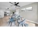 Chic dining room with a glass table set, designer decor, and hardwood floors at 3153 Irving St, Sarasota, FL 34237