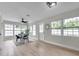Bright and airy dining area with modern furnishings, hardwood floors, and views of the backyard at 3153 Irving St, Sarasota, FL 34237
