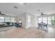 Inviting living and dining area featuring hardwood floors, a modern table set, and ample natural light at 3153 Irving St, Sarasota, FL 34237