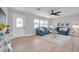 Cozy living room with a decorative front door, recessed lighting, and comfortable seating arrangement at 3153 Irving St, Sarasota, FL 34237