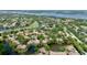 Gorgeous aerial view highlighting the home near a golf course and scenic waterways at 3362 Sandleheath # 12, Sarasota, FL 34235