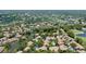 Picturesque aerial view highlights homes with lush surroundings and community waterways at 3362 Sandleheath # 12, Sarasota, FL 34235