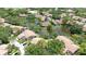 Beautiful community aerial showcasing homes with lush trees and peaceful waterways at 3362 Sandleheath # 12, Sarasota, FL 34235