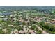 Stunning aerial view showcases the community nestled amid lush trees and waterways at 3362 Sandleheath # 12, Sarasota, FL 34235