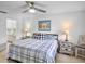 Bright bedroom with a ceiling fan, neutral walls and tiled floor at 3362 Sandleheath # 12, Sarasota, FL 34235
