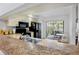 Kitchen with countertops, black appliances, and a view to an outdoor patio seating area at 3362 Sandleheath # 12, Sarasota, FL 34235