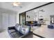 Bright and airy living area with pond views, tile flooring, and a glimpse into dining area at 3362 Sandleheath # 12, Sarasota, FL 34235