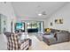 Spacious living room with tranquil pond views, comfortable seating, and lots of natural light at 3362 Sandleheath # 12, Sarasota, FL 34235