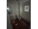 Bathroom features a vanity sink, toilet, bathtub and shower combination, and window at 3622 N 51St St, Tampa, FL 33619