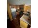 The kitchen has wooden cabinets, stainless steel appliances, and a sink next to a breakfast bar at 3622 N 51St St, Tampa, FL 33619