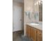 A bathroom with a vanity, sink, mirror, lighting, and shower at 3818 Chris Dr, Wesley Chapel, FL 33543
