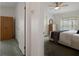 A bedroom with a bed, dresser, closet and ceiling fan at 3818 Chris Dr, Wesley Chapel, FL 33543