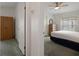 A bedroom with a bed, dresser, closet and ceiling fan at 3818 Chris Dr, Wesley Chapel, FL 33543