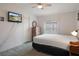 A bedroom with a television, bed, dresser, ceiling fan and window at 3818 Chris Dr, Wesley Chapel, FL 33543