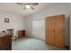The bedroom features a ceiling fan, natural light from the window, and furniture at 3818 Chris Dr, Wesley Chapel, FL 33543