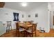 Bright dining room features wood floors, a wooden table with chairs, and decor at 3818 Chris Dr, Wesley Chapel, FL 33543