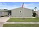 Charming single-story home with tidy lawn, flagpole and covered parking at 3818 Chris Dr, Wesley Chapel, FL 33543