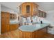 Kitchen features wood cabinets, laminate countertops, and updated appliances at 3818 Chris Dr, Wesley Chapel, FL 33543