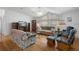 Bright living room with hardwood floors, large windows and vaulted ceiling at 3818 Chris Dr, Wesley Chapel, FL 33543