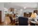 Open-concept living space with hardwood floors, ceiling fan, and bright lighting at 3818 Chris Dr, Wesley Chapel, FL 33543