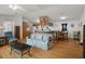 Open living area leading into the kitchen and dining space with hardwood floors at 3818 Chris Dr, Wesley Chapel, FL 33543