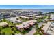 High aerial view of a waterfront neighborhood showcasing boat docks, water access, and lush landscaping at 3876 Catalina Dr, Bradenton, FL 34210