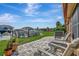 Inviting back patio with seating area overlooking a canal with boat docks on a sunny day at 3876 Catalina Dr, Bradenton, FL 34210