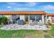 Paver patio includes outdoor seating, a barbecue area, and lush green lawn at 3876 Catalina Dr, Bradenton, FL 34210