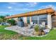 Backyard patio with chairs, plants, and well-maintained exterior at 3876 Catalina Dr, Bradenton, FL 34210
