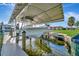 Exterior boat dock featuring a boat lift system, and waterfront access at 3876 Catalina Dr, Bradenton, FL 34210