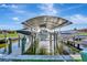 Wide shot of canal featuring multiple private boat docks and lifts, excellent boating community at 3876 Catalina Dr, Bradenton, FL 34210