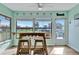 Cozy breakfast nook with bar-height table, chairs, and waterfront views at 3876 Catalina Dr, Bradenton, FL 34210
