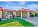 Inviting home exterior showing well-maintained lawn, carport, and charming curb appeal at 3876 Catalina Dr, Bradenton, FL 34210