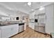 Bright kitchen features stainless steel appliances, granite countertops, and wood flooring at 3876 Catalina Dr, Bradenton, FL 34210