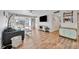Bright living room featuring wood floors, stylish decor, and comfortable seating at 3876 Catalina Dr, Bradenton, FL 34210