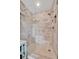 Modern shower featuring gray tiling, a glass partition, and built-in shelving at 3876 Catalina Dr, Bradenton, FL 34210