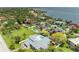 Waterfront property featuring a private pool and backyard oasis, with bay views in a tropical setting at 3903 Bayside Dr, Bradenton, FL 34210