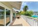 Second story balcony with outdoor dining set overlooking the backyard at 3903 Bayside Dr, Bradenton, FL 34210