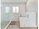 Elegant bathroom featuring a soaking tub, a separate glass-enclosed shower, and stylish tile flooring at 3903 Bayside Dr, Bradenton, FL 34210