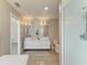 Bright bathroom featuring double vanity sinks, walk-in shower, and neutral tones at 3903 Bayside Dr, Bradenton, FL 34210