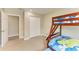 Spacious bedroom with bunk beds and ample storage at 3903 Bayside Dr, Bradenton, FL 34210