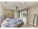 Bedroom with ceiling fan and sliding door to outdoor balcony at 3903 Bayside Dr, Bradenton, FL 34210