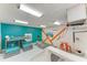 Spacious bonus room with a bunk bed, sitting area, foosball table, and vibrant accent wall at 3903 Bayside Dr, Bradenton, FL 34210