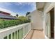 Outdoor deck showcasing lush greenery, palm trees, and blue skies on a sunny day at 3903 Bayside Dr, Bradenton, FL 34210