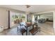 Inviting dining area with sliding doors leading to an outdoor deck with seating, plus views of the living room at 3903 Bayside Dr, Bradenton, FL 34210