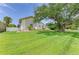 Large lawn with beautiful landscaping surrounds this attractive house that is ready to be called home at 3903 Bayside Dr, Bradenton, FL 34210