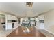 Open kitchen featuring stainless steel appliances, a large island, white cabinetry, and decorative lighting at 3903 Bayside Dr, Bradenton, FL 34210