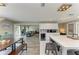 Spacious open-concept layout with kitchen island, adjacent dining area, and seamless flow to the living room at 3903 Bayside Dr, Bradenton, FL 34210